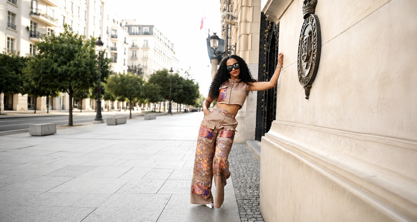 Model wearing the Urban Bloom two-piece set on a sunlit city street